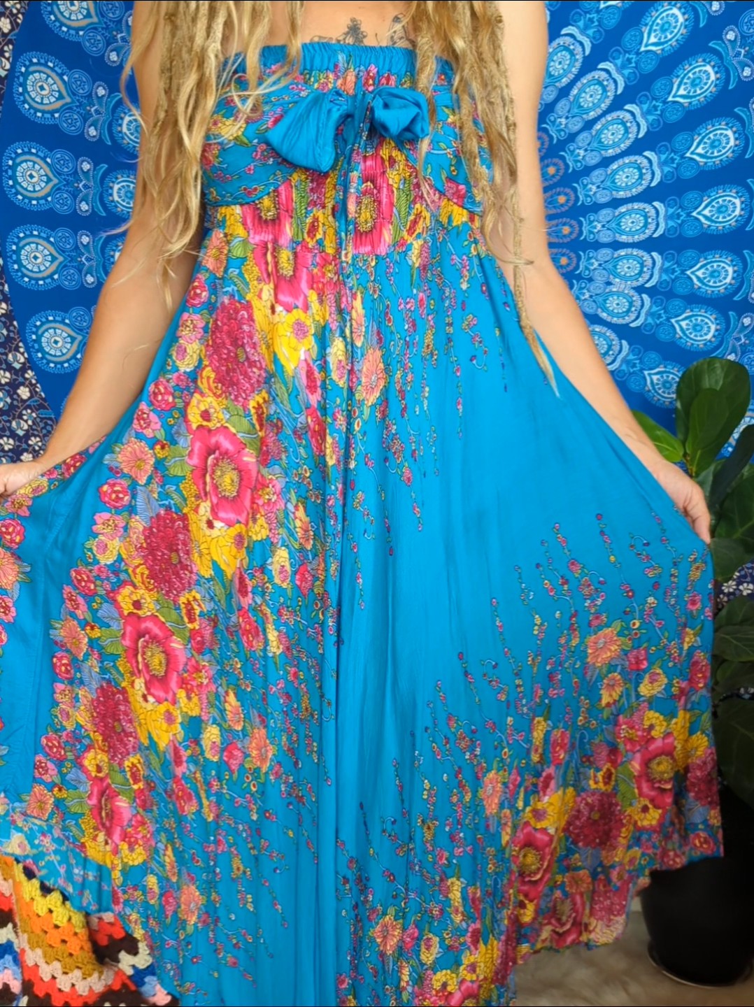 Woman in blue floral dress.