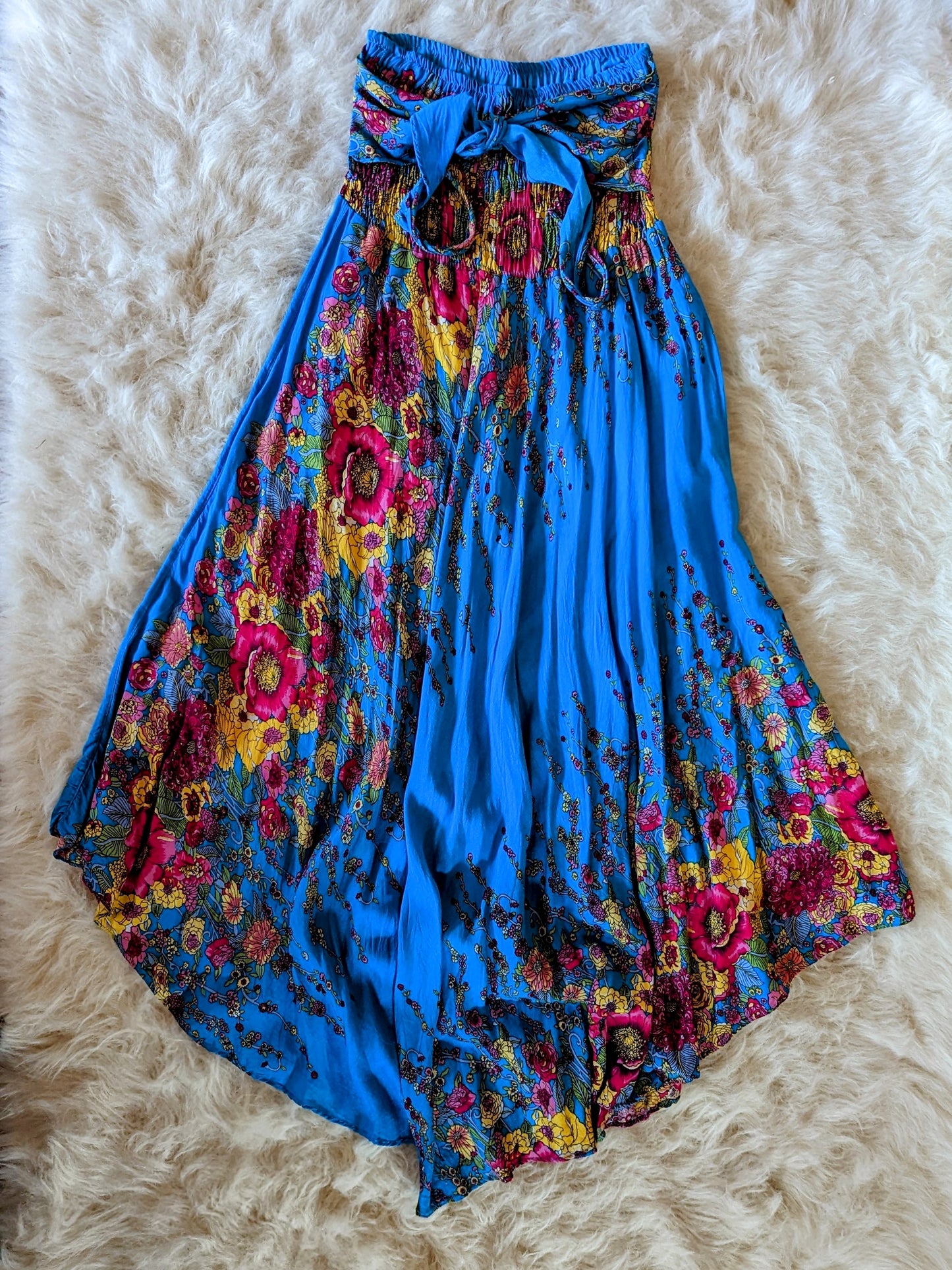 A skirt with a beautiful floral print in shades of blue, adding a touch of elegance and charm to any outfit.